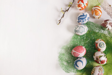 Fototapeta na wymiar white background with decorative Easter eggs with green design