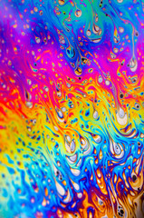 Beautiful psychedelic abstraction formed by light on the surface of a soap bubble