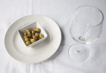 Italian appetizer green olives in a dish