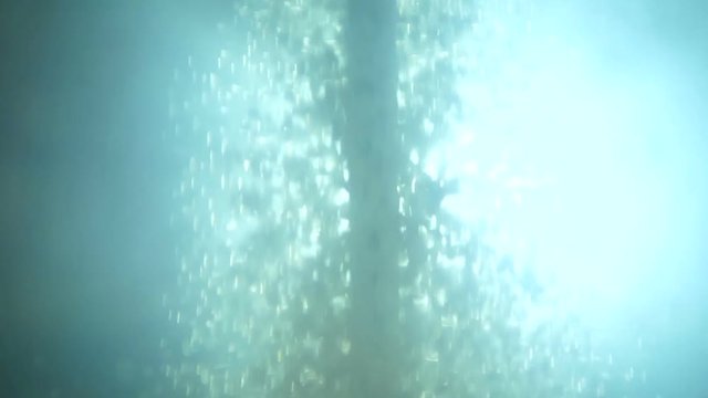 Transparent liquid, can water. Abstractly rotates and is stirred in an autoclave. Simulation of eddy currents. Water ripple shooting with high speed camera, phantom flex.