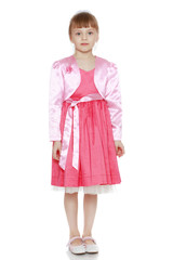 Little blonde girl in red dress.