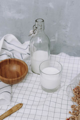 breakfast with granola and bottle and glass of milk
