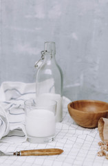 breakfast with granola and bottle and glass of milk