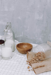 breakfast with granola and bottle and glass of milk