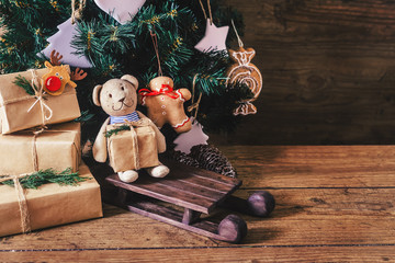 Christmas Gifts with Boxes on Wooden Background. Vintage Style. Closeup, selective focus. Toy,...