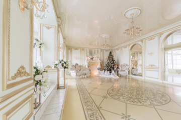 Christmas morning. luxury classic apartments with a white fireplace.