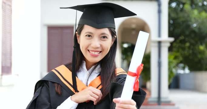 Woman get graduation hold with paper certificate