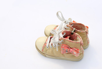 Pair of baby sneakers isolated on white background.