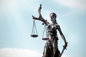Lady justice, themis, statue of justice on sky background