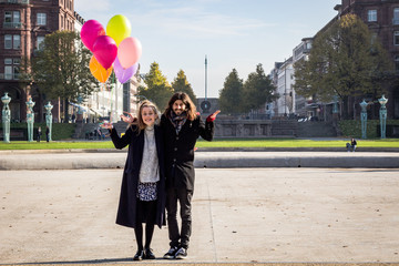 young couple with balloons
