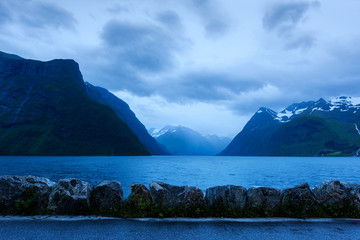 Dramatic evening view of Hjorundfjorden fjord
