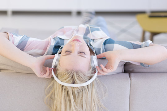 girl enjoying music through headphones