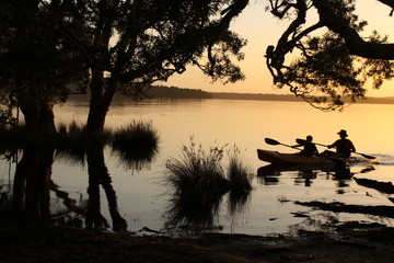 Fun on the lake  in silhouette