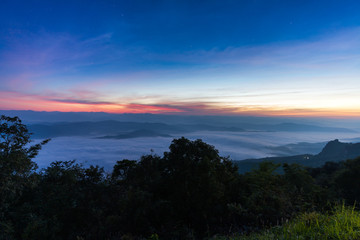Obraz premium Dawn of Sea Mist on the top of Sierra, Doi Samer-Dao, Nan, Northern of Thailand