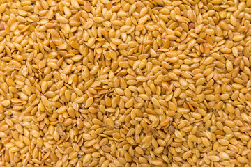Golden Flax seed. Closeup of grains, background use.