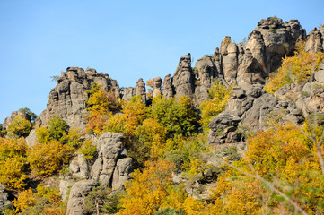 Interesting rock formation and colorful trees in autumn