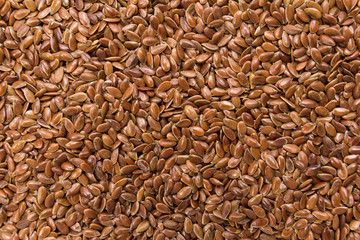 Brown Flax seed. Closeup of grains, background use.