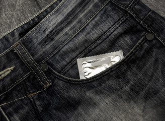 Condom in package in jeans