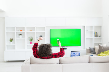 young man in bathrobe enjoying free time