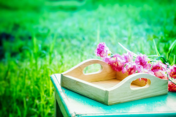 empty tray wooden and flower in garden
