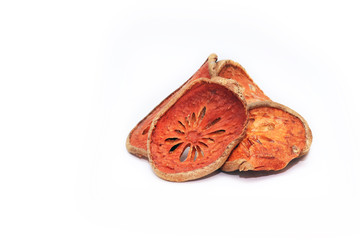 Dry Bael slices fruit isolated in white background. Dry herb for healthy beverage.