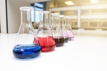 Flasks close up equipment in laboratory background