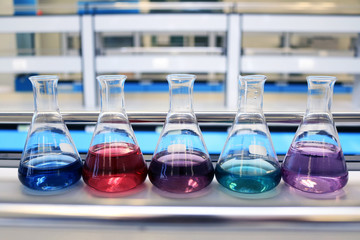 Flasks close up equipment in laboratory background