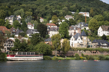 Fototapeta na wymiar River Cruises riding in Rhine and Neckar river bring passengers traveler visit and looking at riverside of Heidelberg old town