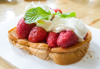Toast bread with strawberry and whipping cream