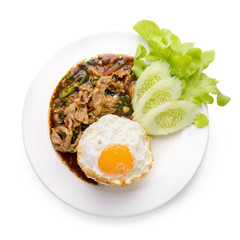 Holy Basil Fried Rice with pork and Fried Egg Sunny side Up isolated on white background