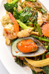 fired noodles with seafood and Spicy Sauce isolated on white background