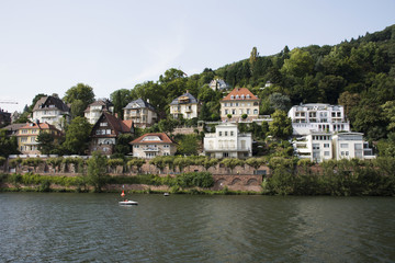 Fototapeta na wymiar Classic and modern building for people living at riverside of Neckar River near heidelberger square