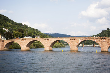 Fototapeta na wymiar German and foreigner travelers walking and visit on Karl Theodor Bridge or Old Bridge of Heidelberg cross over Neckar River