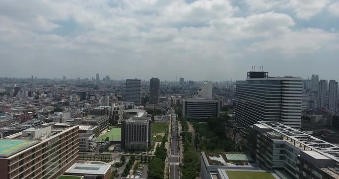 TOKYO, JAPAN – JUNE 2016 : Aerial shot over Nakano area on a beautiful day with cityscape and tall buildings in view