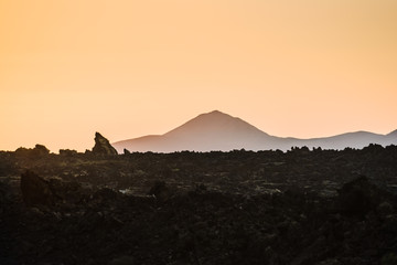 Stunning view of the volcanic landscape at sunset. Lanzarote. Canary Islands. Spain