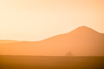 Lonely volcano in the national park of Timanfaya at sunset. Lanzarote. Canary Islands. Spain