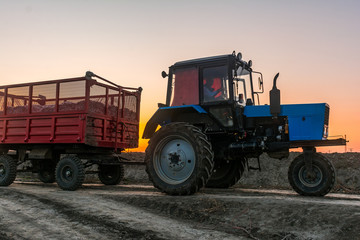 Farm tractor with a trailer