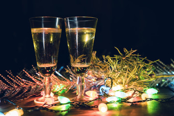 Two Glasses with champagne on a wooden table decorated