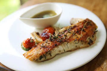 Sea bass fillet on wood background