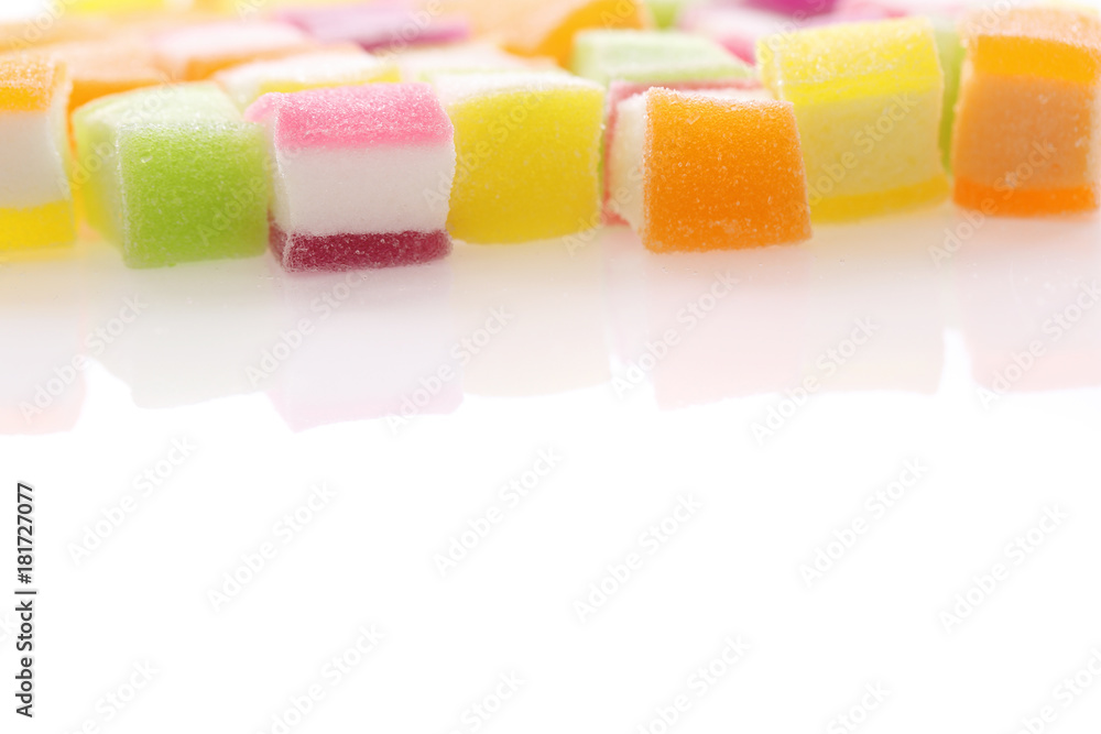 Wall mural Colorful cube jelly candy isolated in white background