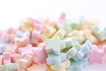 Colourful Star Milk pellets isolated in white background