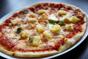 Hawaiian pizza , Pizza with ham pineapple cheese on wood background