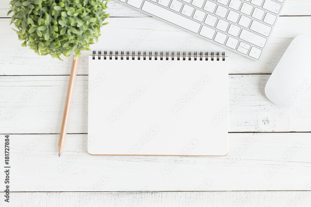 Wall mural flat lay photo of office desk with mouse and keyboard,empty open notebook on white wood table top vi