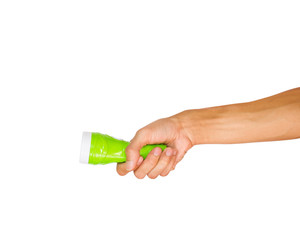 Hand holding green flashlight isolated on white background with clipping path.  flashlight is a...