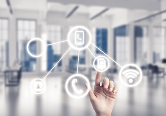 Modern office interior and close of businesswoman hand choosing 