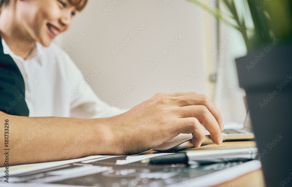 Aufkleber women are using the laptop on the table in the office, where men sit together is using the idea of w