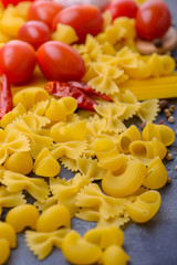 Raw pasta and tomatoes