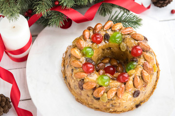 Beautiful delicious homemade  Christmas fruit cake on white platter
