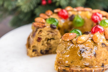 Beautiful delicious homemade  Christmas fruit cake on white platter