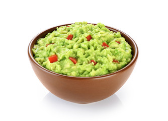 Bowl with guacamole isolated on white background.